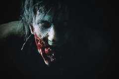 A close up shot of a zombie from Resident Evil 2 (2019)